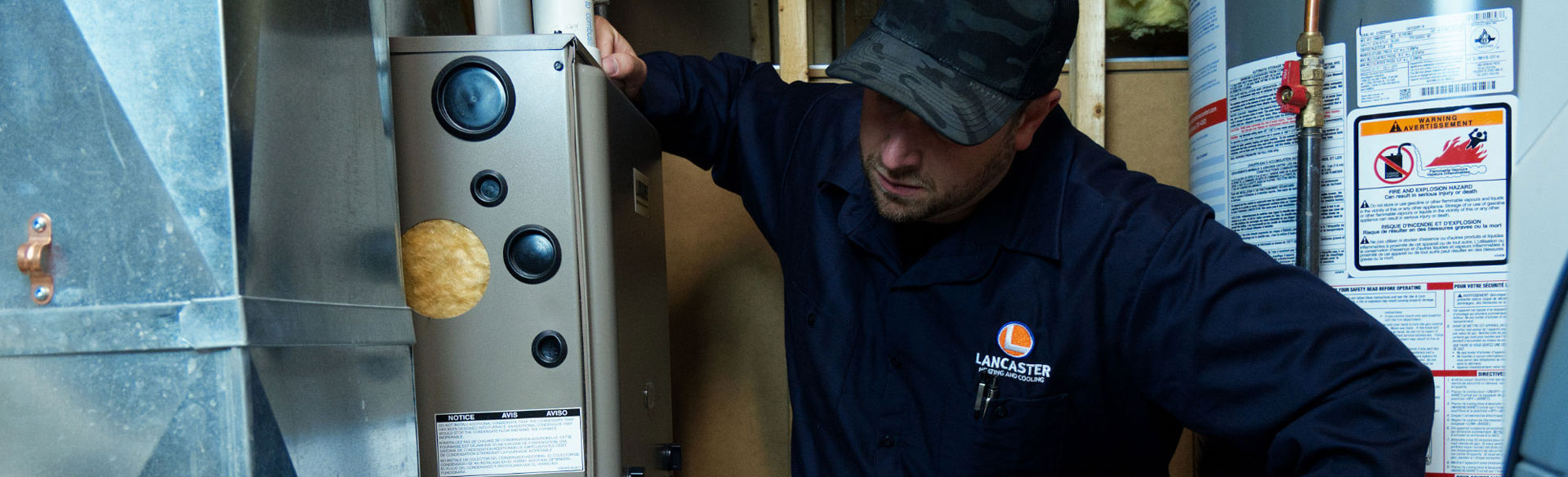 HVAC technician performing planned maintenance on a Hamilton resident's furnace.